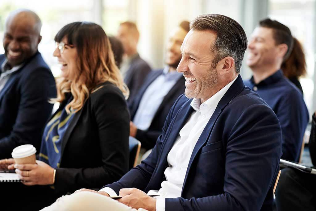 People in a meeting happy that they can hear